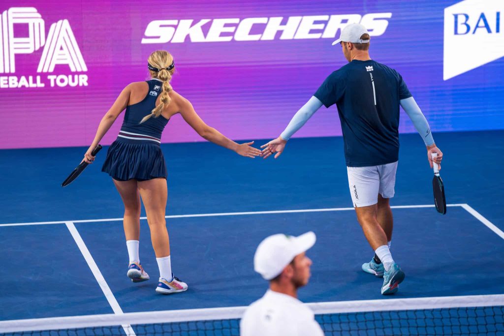 people playing pickleball on outdoor court